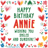 A colorful animated card for Annie’s birthday featuring playful hearts, cheerful flowers, and a handwritten message wishing smiles and sunshine.