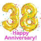 Sparkling gold balloons forming the number 38 with a burst of multicolored confetti and vibrant pink 'Happy Anniversary' text.