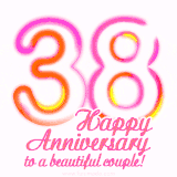 Stylish pink and yellow neon numbers '38' glowing brightly with a heartfelt 'Happy Anniversary to a beautiful couple!' written in pink cursive text.