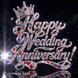 Silver Happy Wedding Anniversary script embellished with bright diamonds and colorful gems, topped with a jeweled royal tiara on a pitch black sparkling background.