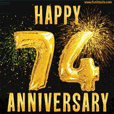 Bright golden balloons shaped like '74' with dazzling fireworks and 'Happy Anniversary' text shining on a black background.