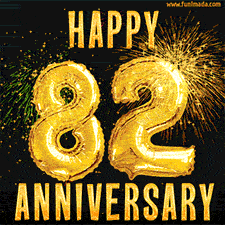 Bright golden balloons shaped like '82' with dazzling fireworks and 'Happy Anniversary' text shining on a black background.