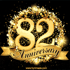 Shimmering '82 Anniversary' in gold, encased in a radiant confetti circle with a golden ribbon accent at the bottom.