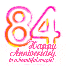 Stylish pink and yellow neon numbers '84' glowing brightly with a heartfelt 'Happy Anniversary to a beautiful couple!' written in pink cursive text.