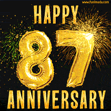 Bright golden balloons shaped like '87' with dazzling fireworks and 'Happy Anniversary' text shining on a black background.