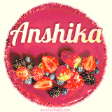 Beautifully decorated red velvet berry birthday cake with vibrant fruits and a glowing 'Anshika' name, adding a touch of sweetness and sparkle.