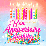 A white birthday cake covered in colorful sprinkles, topped with bright candles, and French text 'Bon Anniversaire Anshika' on a pastel gradient background in an animated GIF.