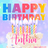 A vibrant animated name GIF with the words 'Happy Birthday Anthia' with colorful candles on a creamy cake. The background sparkles with pastel shades, adding a festive touch.