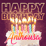 A colorful birthday cake topped with lit candles, with the words 'Happy Birthday Anthousa' in bold glowing letters on a burgundy background. Animated flames add a festive touch.