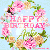 A charming animated GIF featuring 'Happy Birthday Antje' in pink and green text, surrounded by delicate roses, leaves, and fluttering butterflies on a soft light blue pastel background.