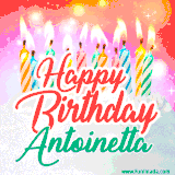 Bright birthday candles with rainbow flames on a cake, alongside the text 'Happy Birthday Antoinetta' in vibrant script in this celebratory animated GIF.