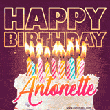 A colorful birthday cake topped with lit candles, with the words 'Happy Birthday Antonette' in bold glowing letters on a burgundy background. Animated flames add a festive touch.