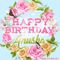 A charming animated GIF featuring 'Happy Birthday Anusha' in pink and green text, surrounded by delicate roses, leaves, and fluttering butterflies on a soft light blue pastel background.