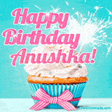 A festive cupcake with pink icing, a gingham bow, and a lit animated sparkler, paired with 'Happy Birthday Anushka!' in bright pink text.