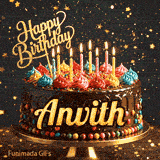 Close-up of a decorative chocolate cake with a gold Happy Birthday topper and warm glowing candle flames, made for Anvith.