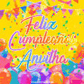 A bright and festive GIF with the text 'Feliz Cumpleaños Anvitha' in Spanish in colorful fonts, surrounded by confetti, balloons, and festive banners on a vibrant yellow background.