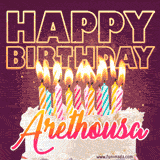 A colorful birthday cake topped with lit candles, with the words 'Happy Birthday Arethousa' in bold glowing letters on a burgundy background. Animated flames add a festive touch.