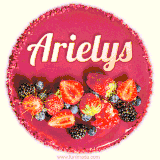 Beautifully decorated red velvet berry birthday cake with vibrant fruits and a glowing 'Arielys' name, adding a touch of sweetness and sparkle.