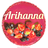 Beautifully decorated red velvet berry birthday cake with vibrant fruits and a glowing 'Arihanna' name, adding a touch of sweetness and sparkle.