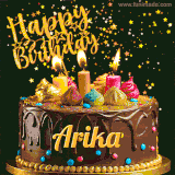 A delightful chocolate birthday cake with bright candles and 'Happy Birthday Arika' written in gold amidst a shower of animated stars.