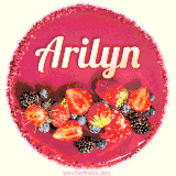 Beautifully decorated red velvet berry birthday cake with vibrant fruits and a glowing 'Arilyn' name, adding a touch of sweetness and sparkle.