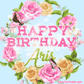 A charming animated GIF featuring 'Happy Birthday Aris' in pink and green text, surrounded by delicate roses, leaves, and fluttering butterflies on a soft light blue pastel background.