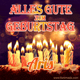 An animated GIF featuring 'Alles Gute Zum Geburtstag Aris' in glowing red and gold letters above a cake with colorful lit candles, set against a festive sparkling background.