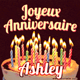 A Happy Birthday GIF in French featuring a festive birthday cake adorned with bright candles and the glowing text 'Joyeux Anniversaire Ashley' in a cheerful style.
