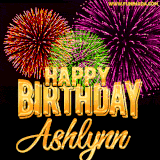 A golden 'Happy Birthday Ashlynn' message with vibrant fireworks in the background, creating a festive and celebratory vibe in this animated name GIF.