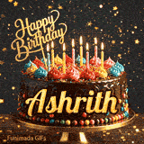 A delicious-looking chocolate cake topped with multiple lit candles and a golden Happy Birthday sign, personalized for Ashrith.