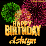 A captivating GIF with bursts of green, pink, and orange fireworks lighting up the night sky, accompanied by 'Happy Birthday Ashtyn' in glowing golden text.