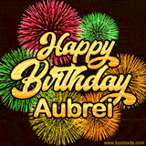 Golden text reading 'Happy Birthday Aubrei' surrounded by vibrant fireworks in red, green, and yellow, set against a dark background in this celebratory birthday GIF.