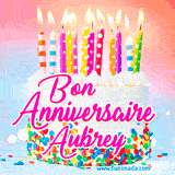 A white birthday cake covered in colorful sprinkles, topped with bright candles, and French text 'Bon Anniversaire Aubrey' on a pastel gradient background in an animated GIF.