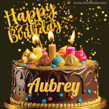 A delightful chocolate birthday cake with bright candles and 'Happy Birthday Aubrey' written in gold amidst a shower of animated stars.