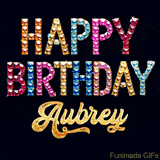 Vibrant luxury birthday greeting card for Aubrey, showing glittering gemstone letters and golden calligraphy on a dark background with twinkling shine effects.