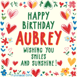 A colorful animated card for Aubrey’s birthday featuring playful hearts, cheerful flowers, and a handwritten message wishing smiles and sunshine.