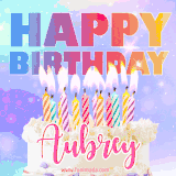 A vibrant animated name GIF with the words 'Happy Birthday Aubrey' with colorful candles on a creamy cake. The background sparkles with pastel shades, adding a festive touch.