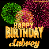 A captivating GIF with bursts of green, pink, and orange fireworks lighting up the night sky, accompanied by 'Happy Birthday Aubrey' in glowing golden text.