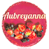 Beautifully decorated red velvet berry birthday cake with vibrant fruits and a glowing 'Aubreyanna' name, adding a touch of sweetness and sparkle.