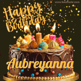 A delightful chocolate birthday cake with bright candles and 'Happy Birthday Aubreyanna' written in gold amidst a shower of animated stars.