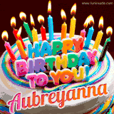 A colorful birthday cake topped with lit candles, with the words 'Happy Birthday Aubreyanna' in bold glowing letters on a burgundy background. Animated flames add a festive touch.