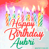 Bright birthday candles with rainbow flames on a cake, alongside the text 'Happy Birthday Aubri' in vibrant script in this celebratory animated GIF.