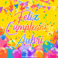A bright and festive GIF with the text 'Feliz Cumpleaños Aubri' in Spanish in colorful fonts, surrounded by confetti, balloons, and festive banners on a vibrant yellow background.