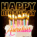 A vibrant animated GIF featuring a delicious birthday cake topped with glowing candles and the name 'Aurelius' in elegant script, and the words 'Happy Birthday' on the black background.