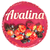 Beautifully decorated red velvet berry birthday cake with vibrant fruits and a glowing 'Avalina' name, adding a touch of sweetness and sparkle.