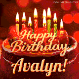 Beautifully decorated red velvet berry birthday cake with vibrant fruits and a glowing 'Avalyn' name, adding a touch of sweetness and sparkle.