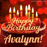Beautifully decorated red velvet berry birthday cake with vibrant fruits and a glowing 'Avalynn' name, adding a touch of sweetness and sparkle.
