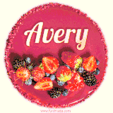 Beautifully decorated red velvet berry birthday cake with vibrant fruits and a glowing 'Avery' name, adding a touch of sweetness and sparkle.