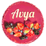 Beautifully decorated red velvet berry birthday cake with vibrant fruits and a glowing 'Avya' name, adding a touch of sweetness and sparkle.