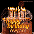 A rich chocolate cake topped with glowing birthday candles and surrounded by bright fireworks. The animated GIF displays the message 'Happy Birthday Avyan' in golden text.